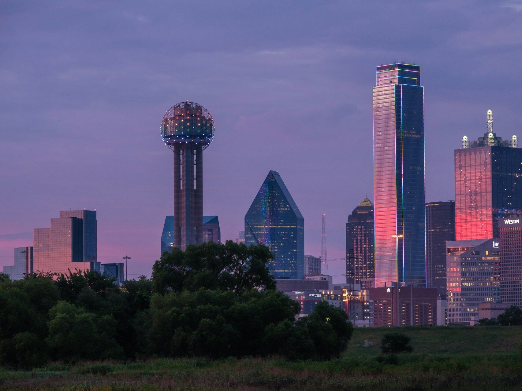 view of a city skyline with a water tower in the foreground