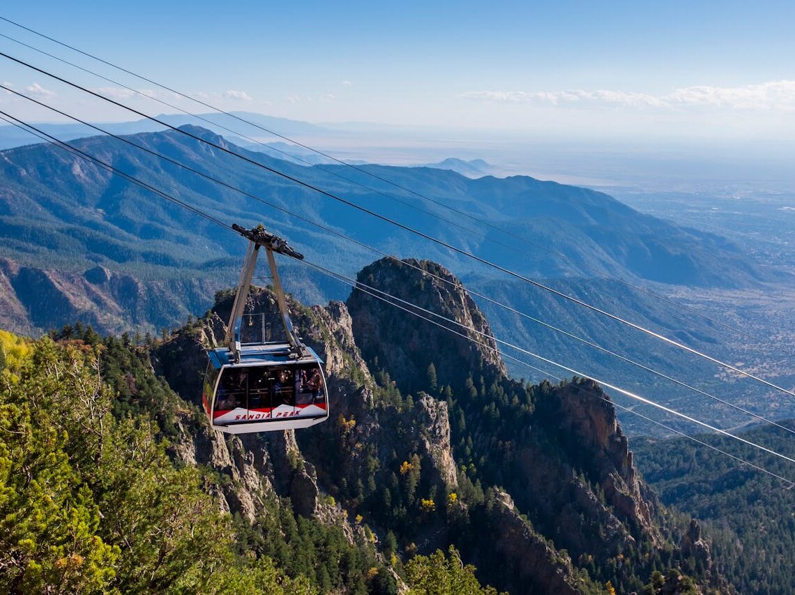 aerial tram way over green mountain