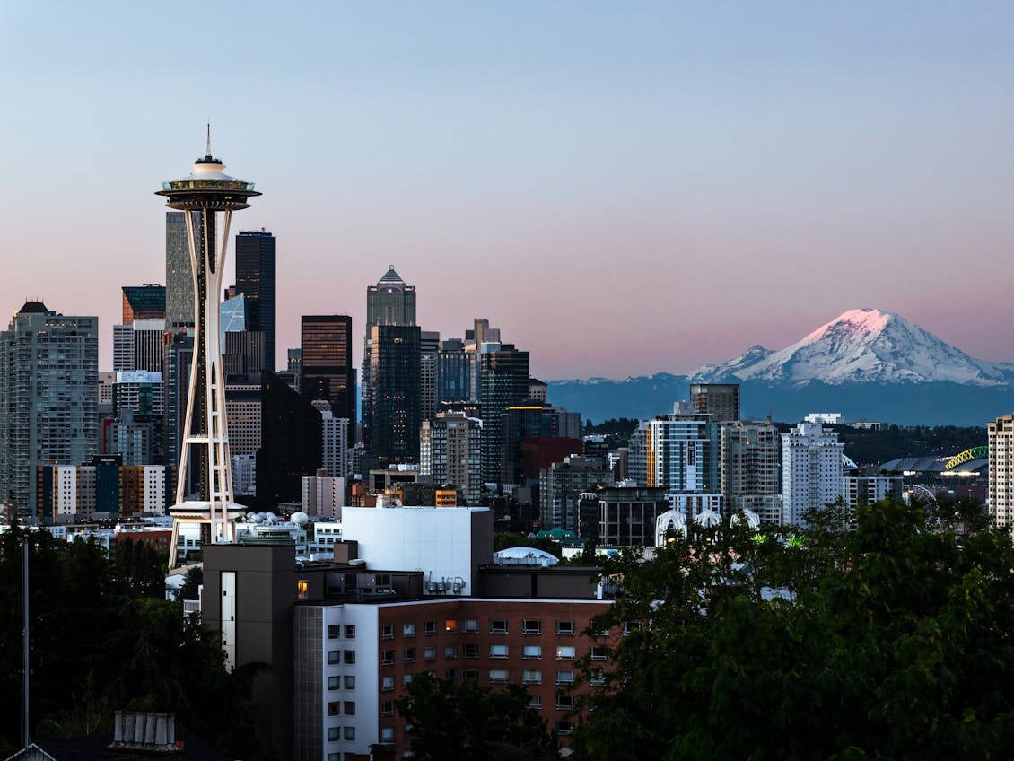modern city downtown next to winter mountain
