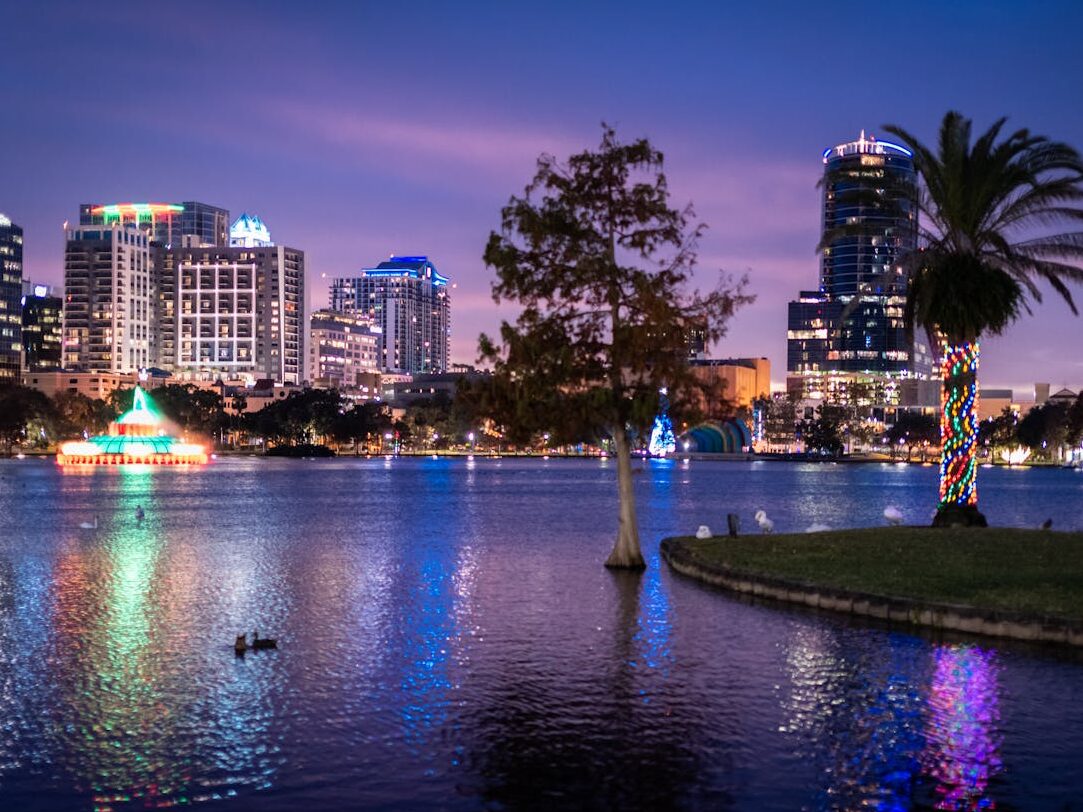 orlando cityscape at twilight with lake eola