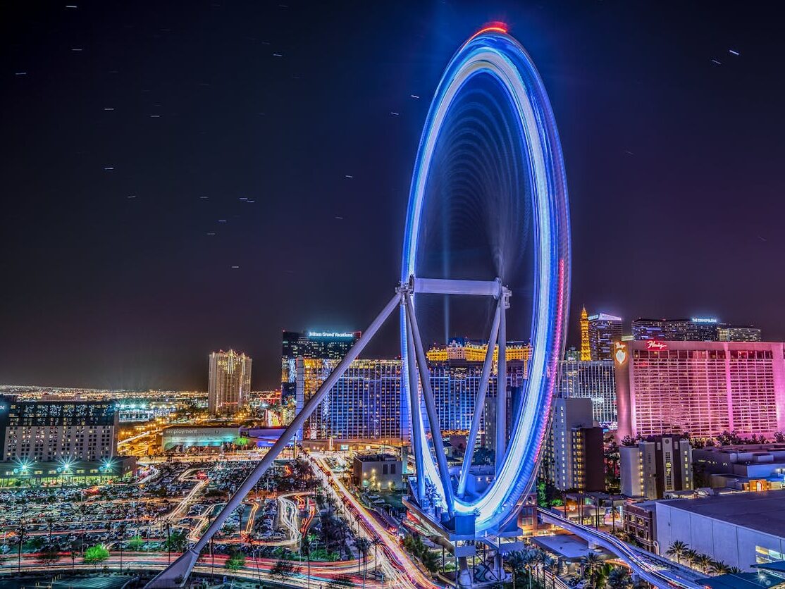 over exposured photo of a ferris wheel at night