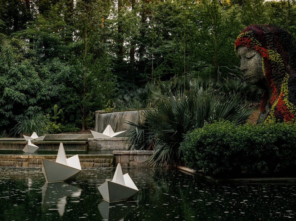 Serene garden with sculptures and water features