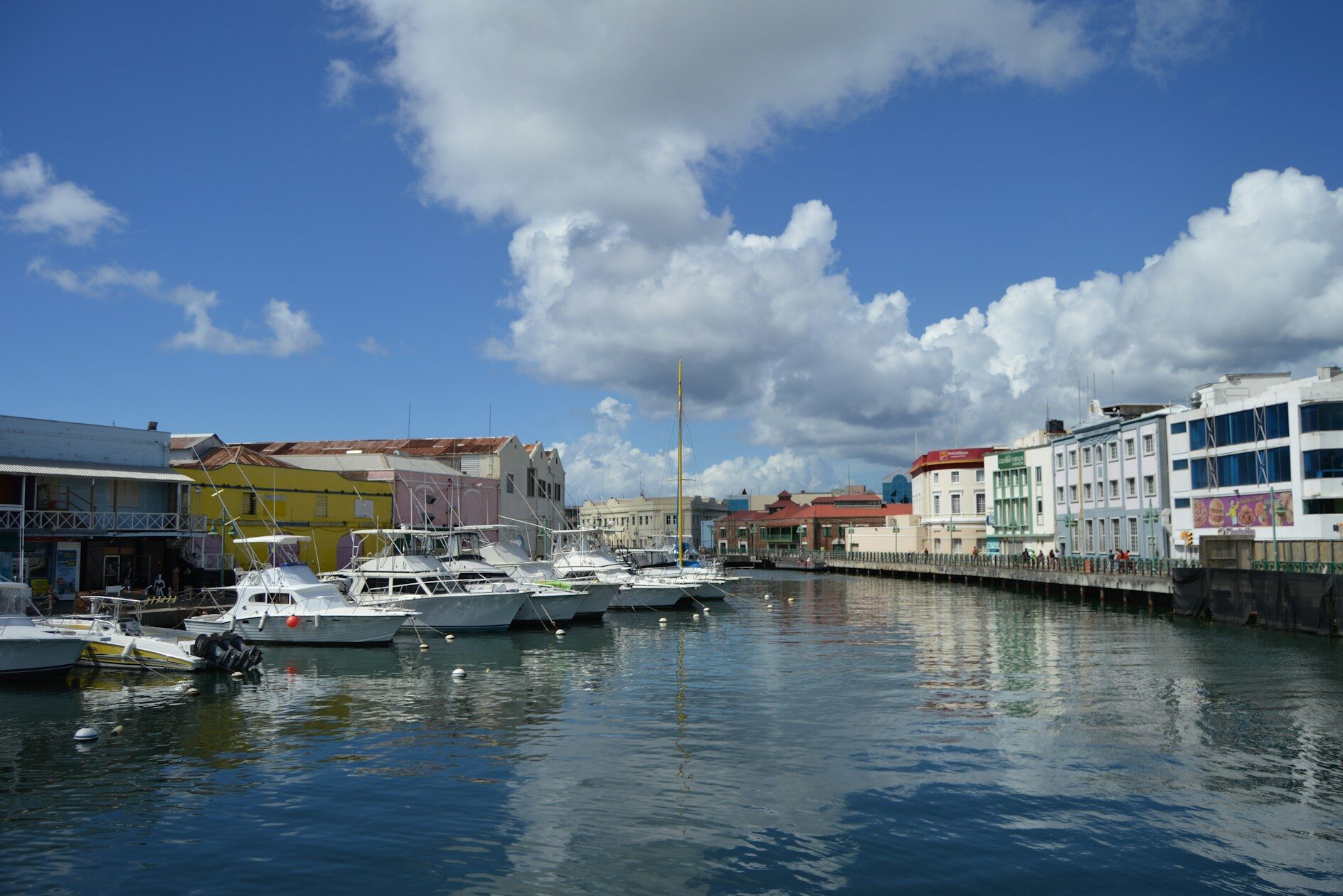 a boat is docked next to a body of water