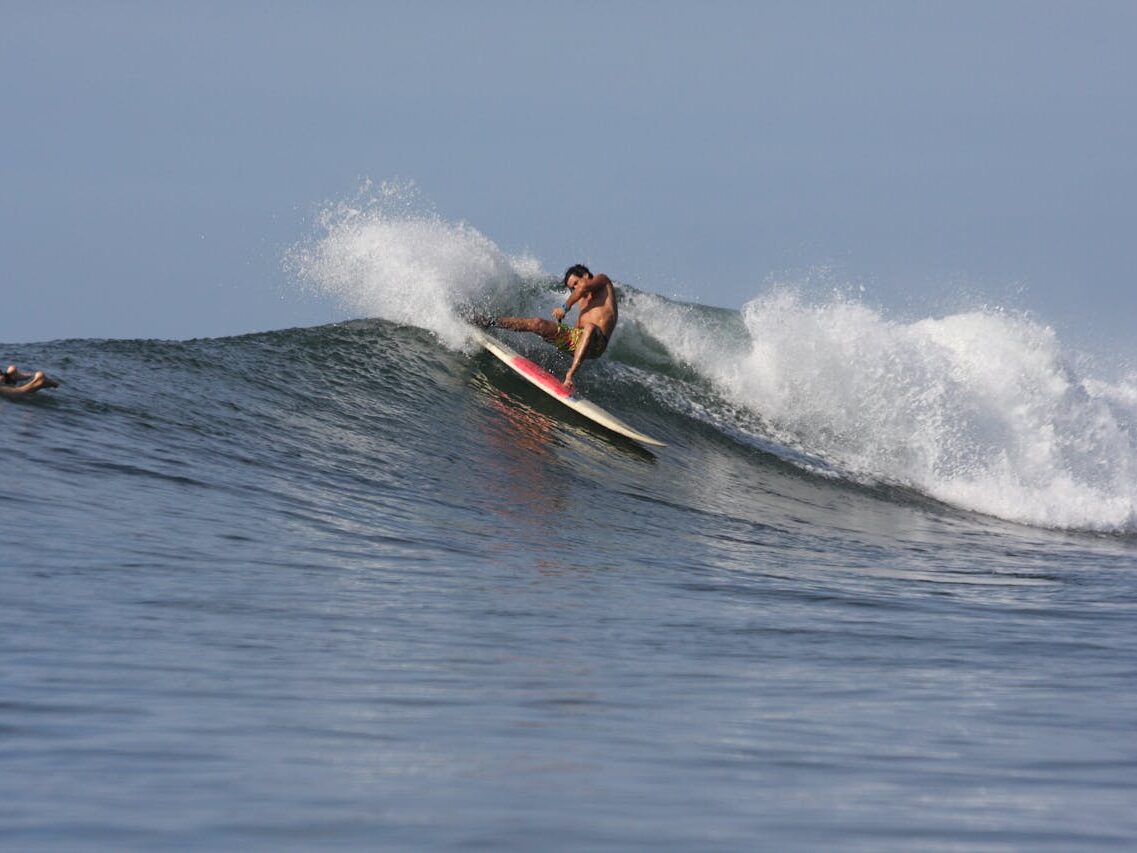 a man surfboarding