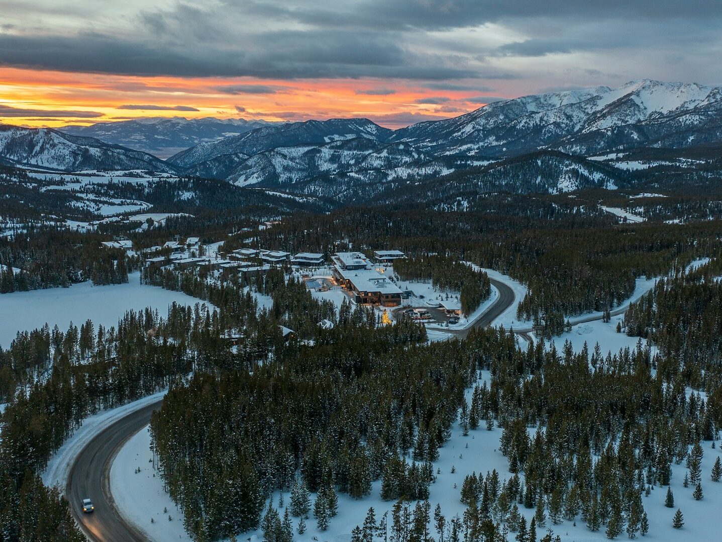 an aerial view of a road in the mountains