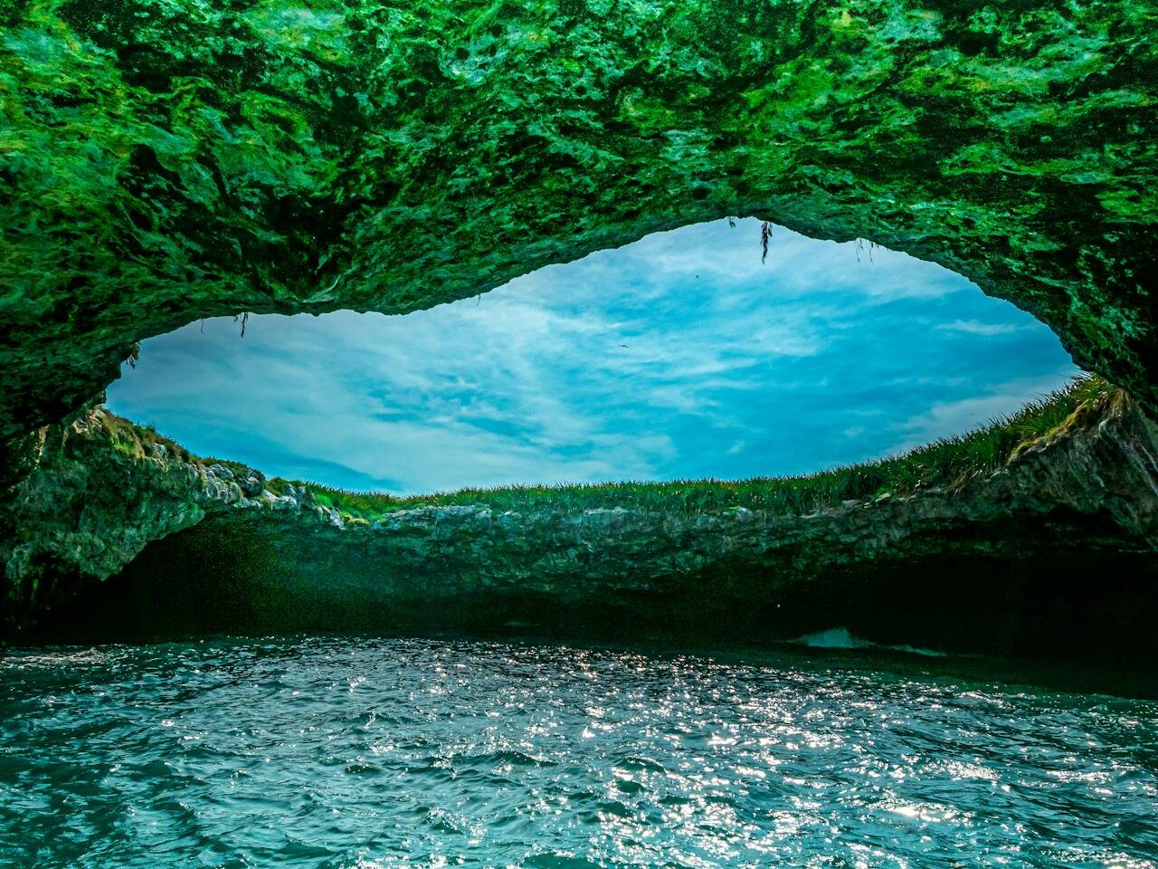 clouds over hole in cave
