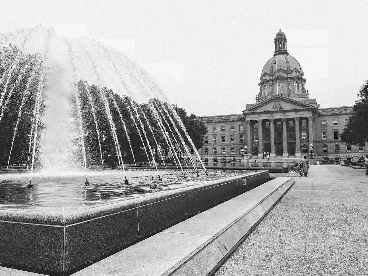 grayscale photography of water fountain