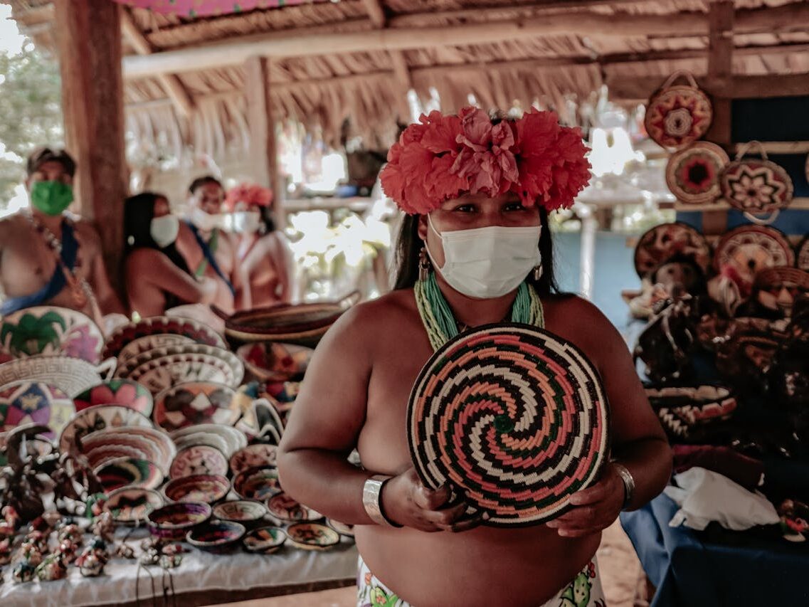man holding a traditional pottery