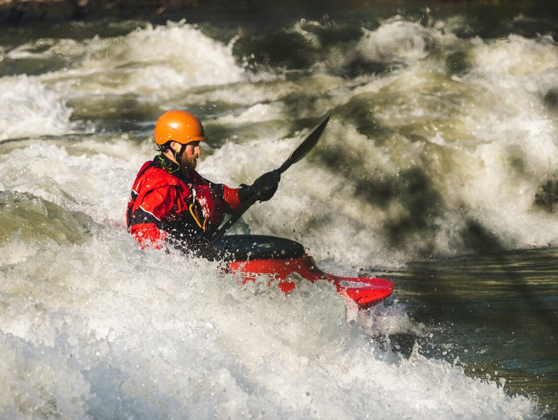 man-on-red-watercraft