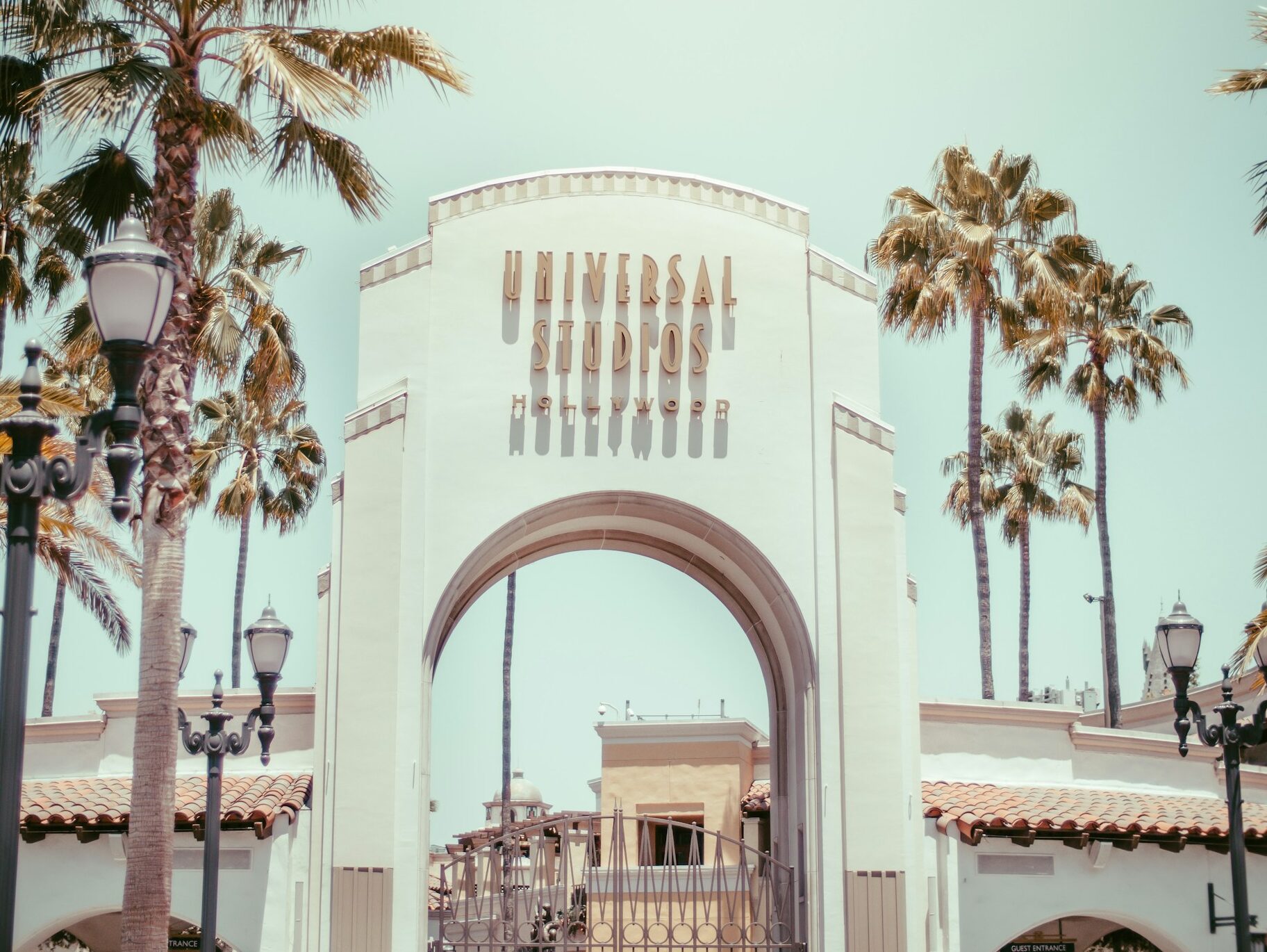 white concrete building near palm trees