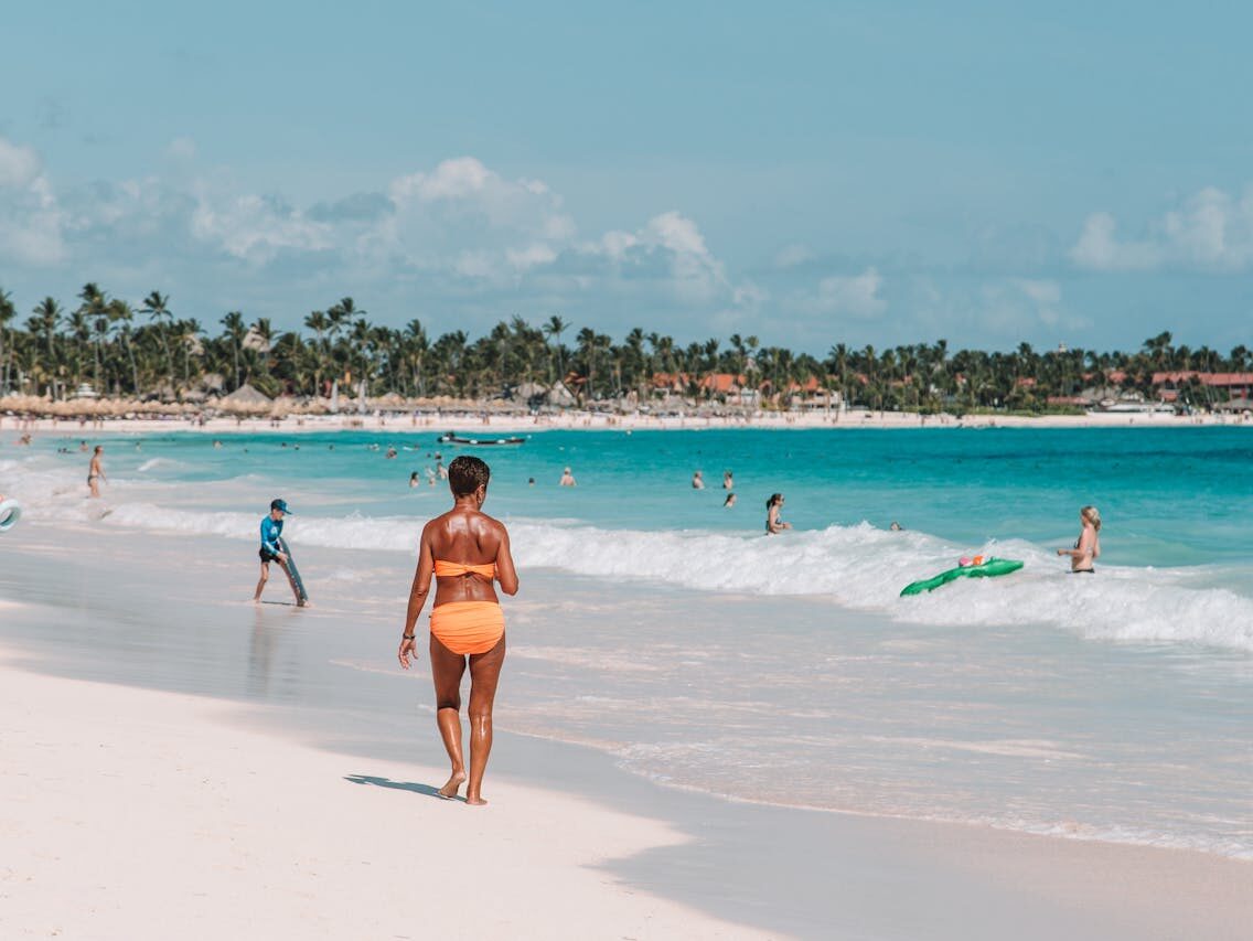 woman walking on seashore